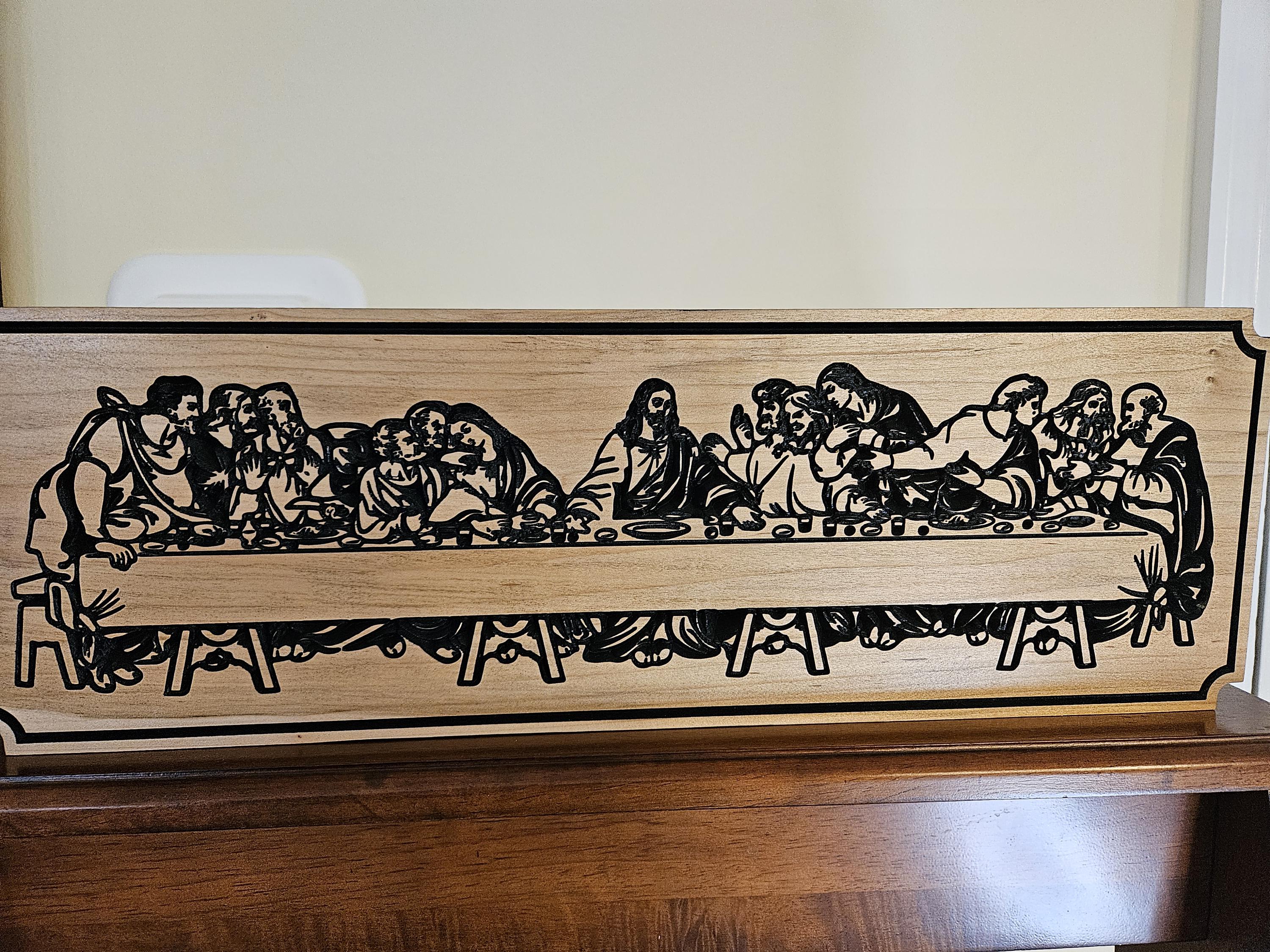 Solid maple engraved last supper.  8x24x1